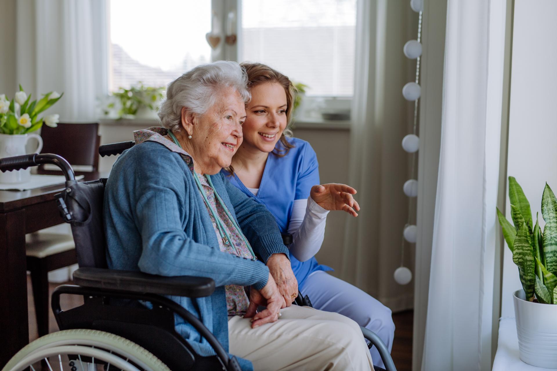 Nurse taking care of elderly woman